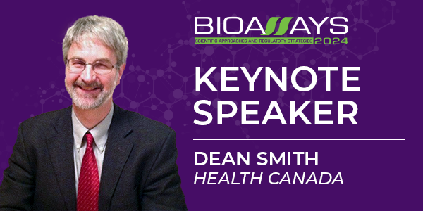 Male with gray hair wearing glasses and suit with red tie with text 'Bioassays 2024 Keynote Speaker Dean Smith Health Canada'