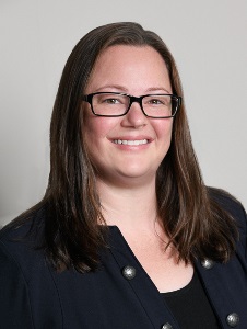 Renee Olson in a black shirt and glasses