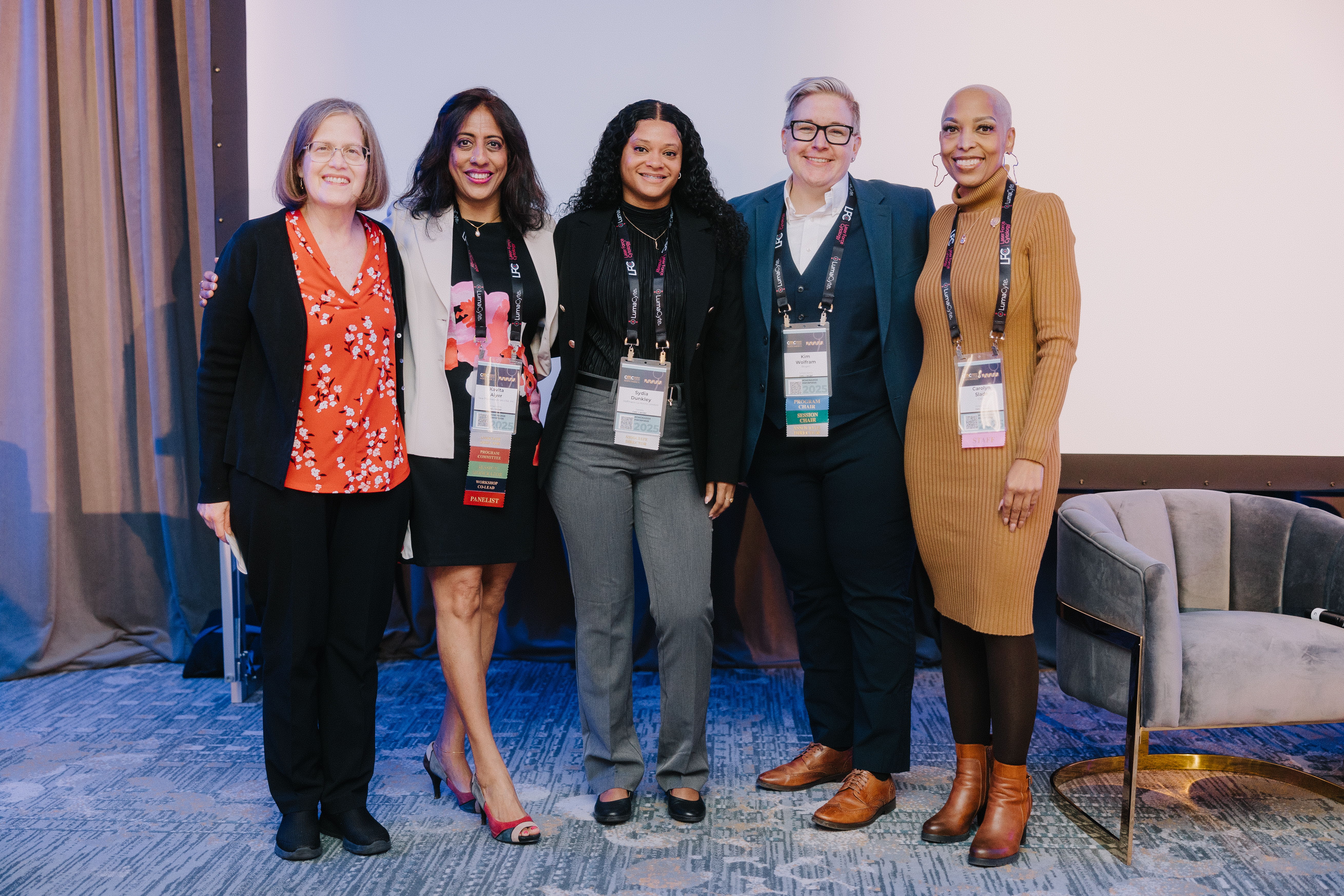 Group of diverse females standing on stage at CASSS conference